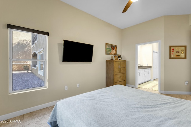 bedroom featuring light tile patterned floors, ensuite bath, and ceiling fan