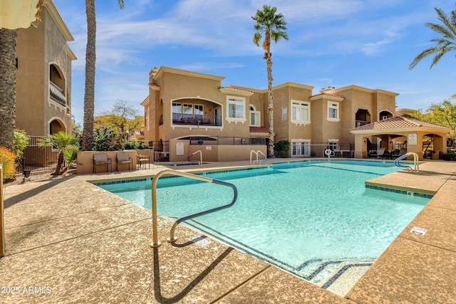 view of swimming pool with a gazebo and a patio area