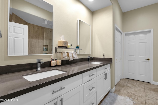 bathroom with tile patterned floors and vanity