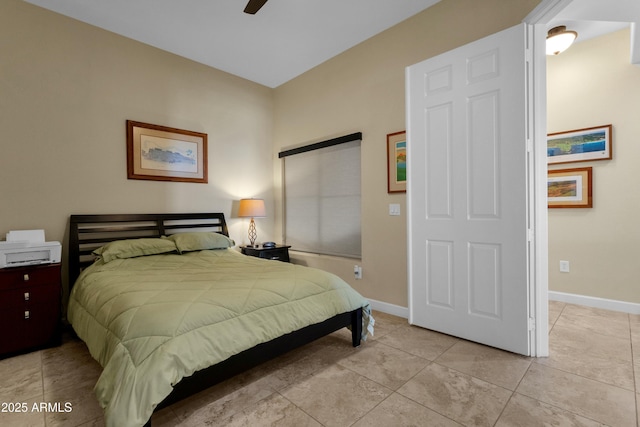 tiled bedroom with ceiling fan