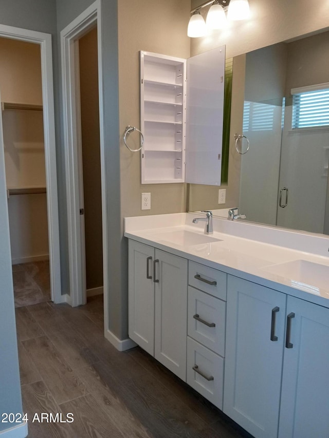 bathroom featuring vanity and hardwood / wood-style flooring