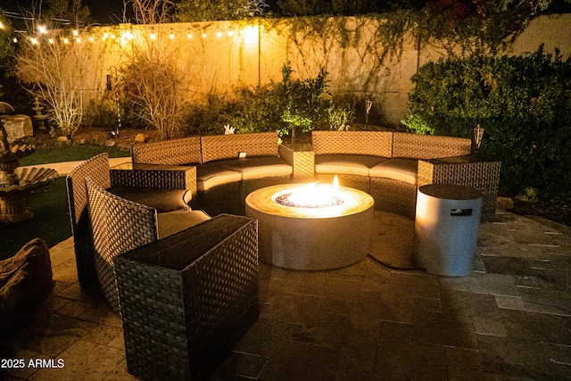 view of patio / terrace featuring an outdoor living space with a fire pit