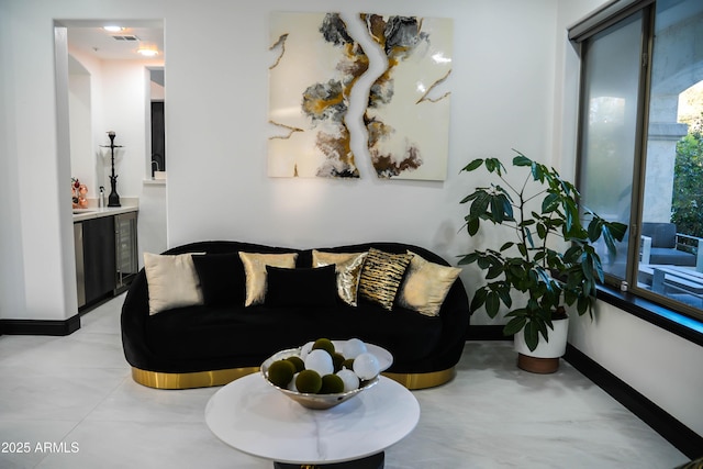 living room with visible vents and baseboards