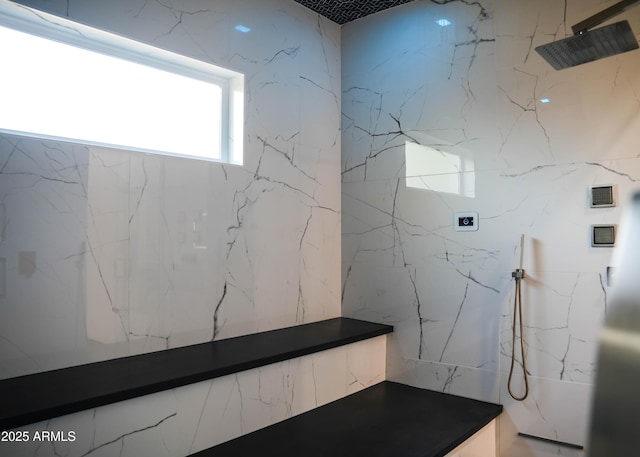 full bathroom featuring a marble finish shower