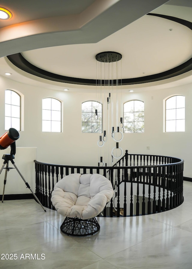 stairway with a tray ceiling