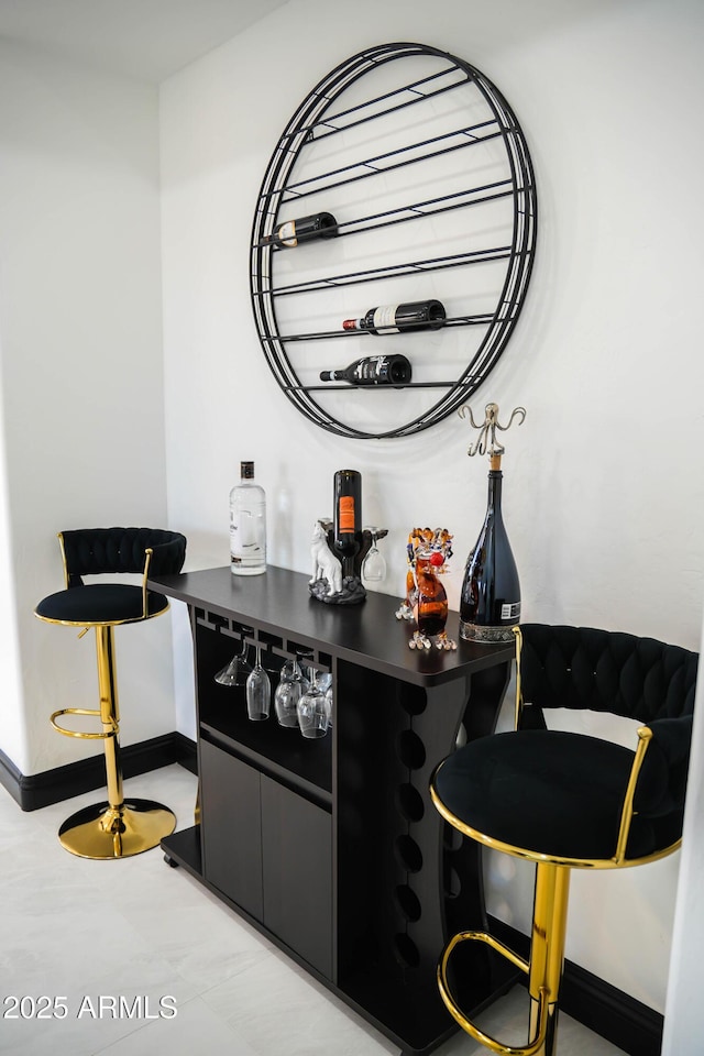 bar with a bar and baseboards