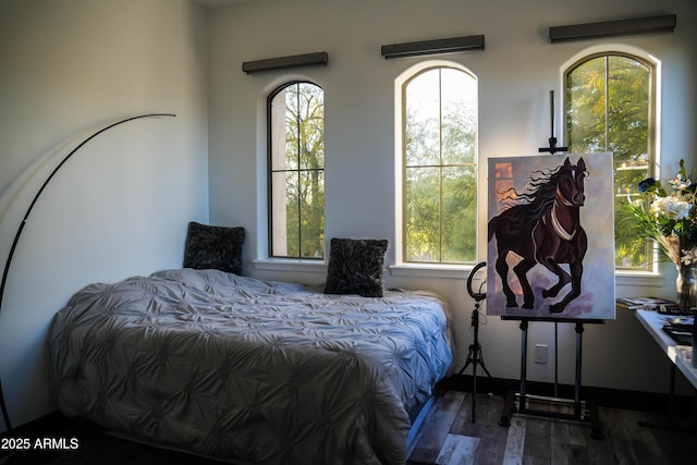 bedroom featuring wood finished floors