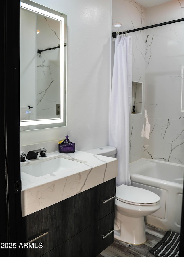 full bathroom with wood finished floors, vanity, toilet, and shower / bath combo with shower curtain