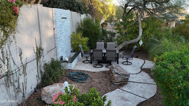 view of patio featuring a fenced backyard and outdoor dining space