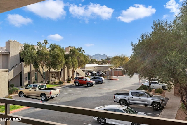 uncovered parking lot with a mountain view