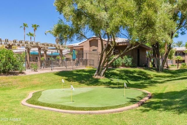 view of community with a yard, fence, and a pergola