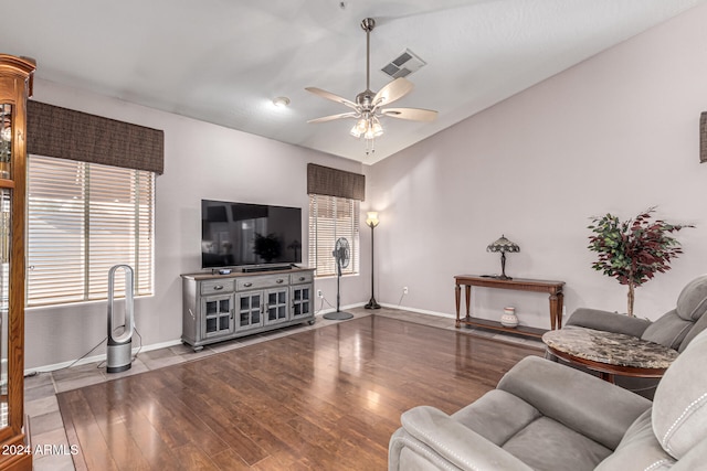 living room with ceiling fan and hardwood / wood-style flooring