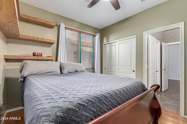 bedroom with ceiling fan and light hardwood / wood-style floors