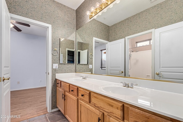 bathroom featuring ceiling fan, wood-type flooring, and vanity