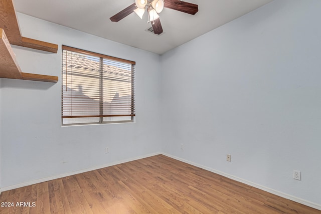 spare room featuring ceiling fan and light hardwood / wood-style floors