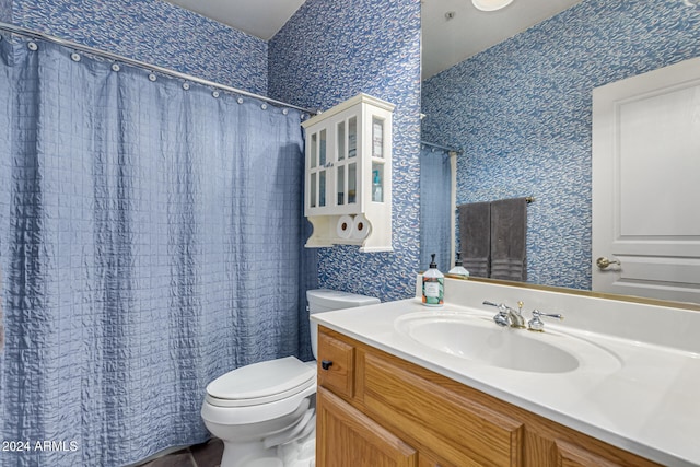 bathroom featuring vanity and toilet