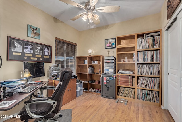 office with light hardwood / wood-style flooring and ceiling fan