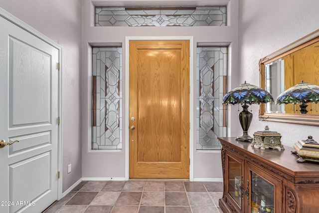 foyer featuring tile patterned floors