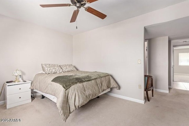 10448 W Caron Dr, Sun City, AZ 85351 - carpeted bedroom with baseboards and a ceiling fan