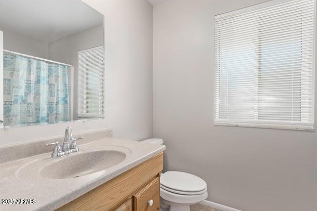 10448 W Caron Dr, Sun City, AZ 85351 - bathroom featuring toilet, vanity, and a shower with curtain