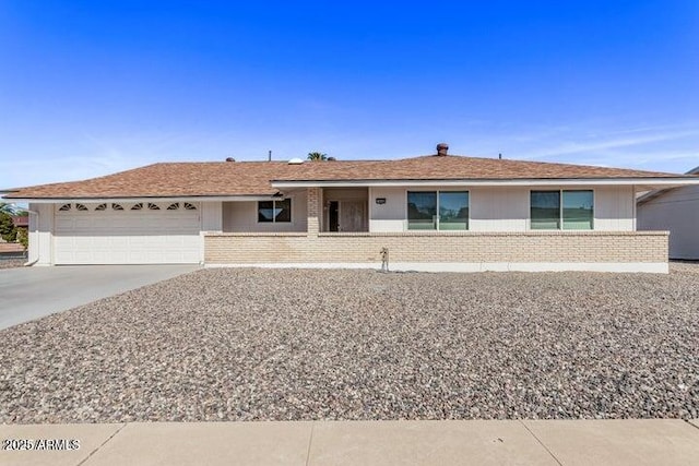 10448 W Caron Dr, Sun City, AZ 85351 - ranch-style house featuring brick siding, a garage, and concrete driveway