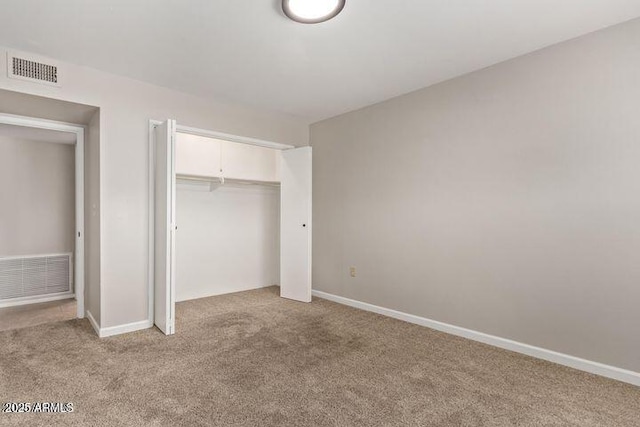10448 W Caron Dr, Sun City, AZ 85351 - unfurnished bedroom with light carpet, a closet, and baseboards