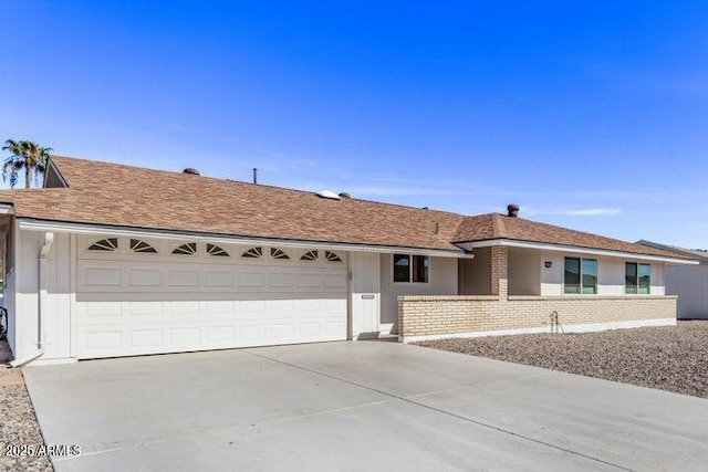 10448 W Caron Dr, Sun City, AZ 85351 - ranch-style house featuring concrete driveway and a garage
