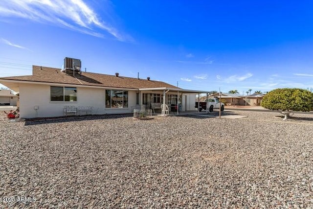 10448 W Caron Dr, Sun City, AZ 85351 - back of house with cooling unit, a patio area, and an attached carport