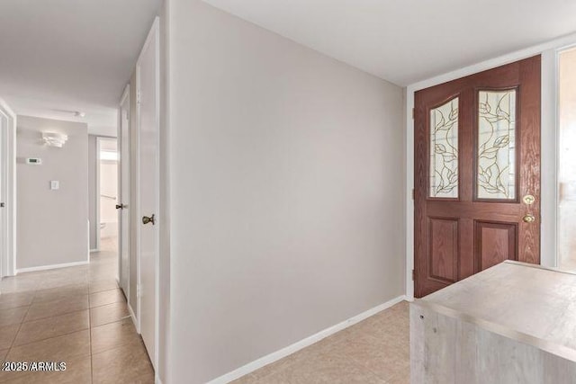 10448 W Caron Dr, Sun City, AZ 85351 - foyer entrance with light tile patterned flooring and baseboards