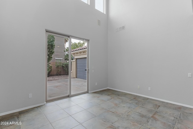 spare room with a high ceiling