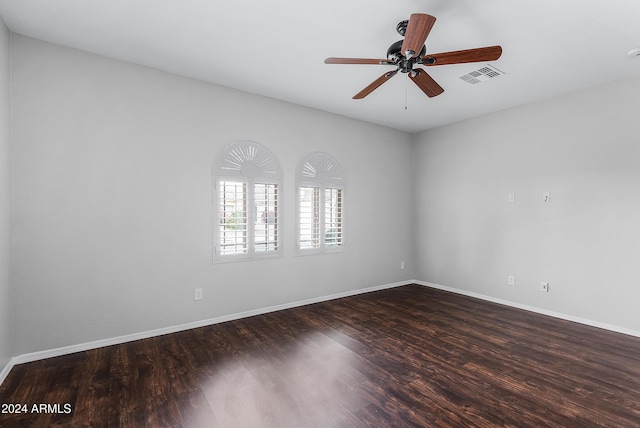 unfurnished room featuring dark hardwood / wood-style floors and ceiling fan