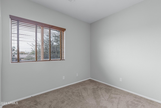 unfurnished room featuring carpet flooring