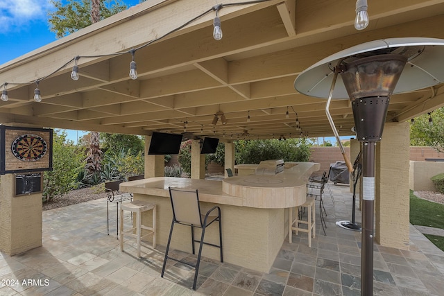 view of patio with a bar