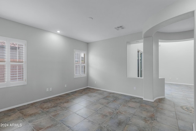 spare room with a wealth of natural light