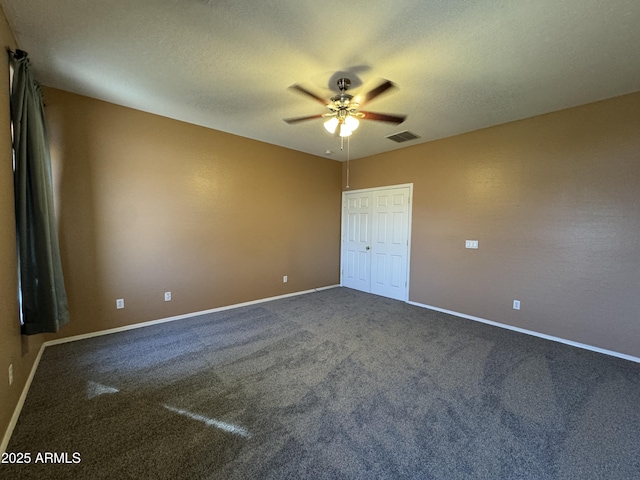 unfurnished bedroom with a textured ceiling, baseboards, and visible vents