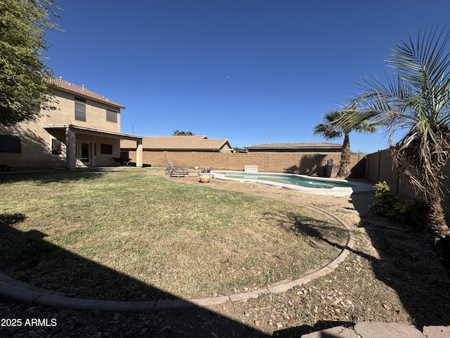 view of yard with a fenced in pool, a patio area, and a fenced backyard