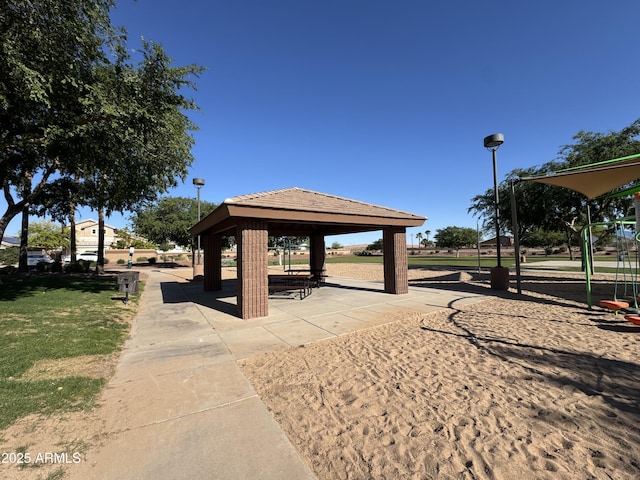 surrounding community featuring a gazebo and a lawn