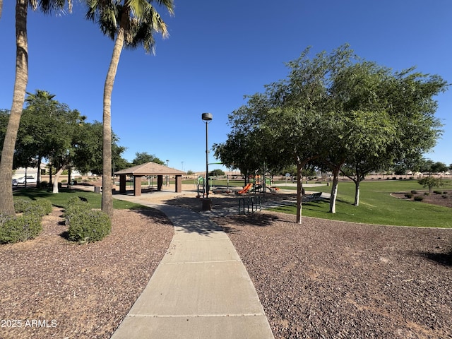 view of property's community with a yard, a gazebo, and playground community