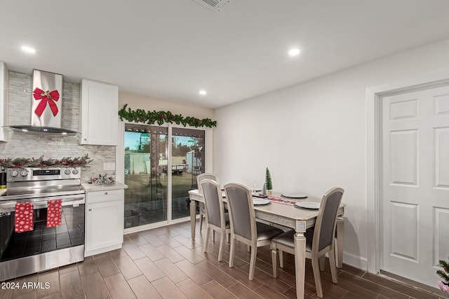 dining space featuring dark wood-type flooring