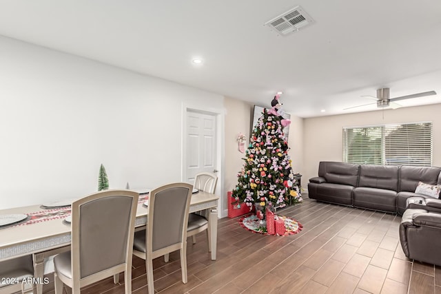 living room featuring hardwood / wood-style flooring and ceiling fan