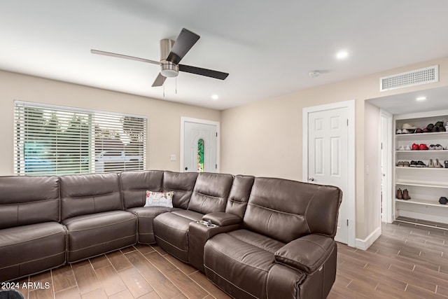 living room featuring hardwood / wood-style flooring and ceiling fan