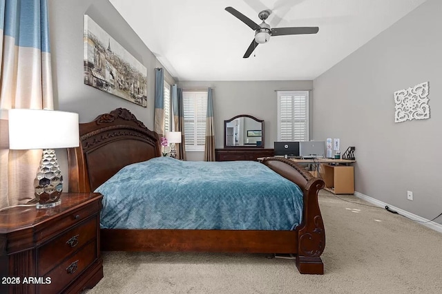 carpeted bedroom featuring ceiling fan and multiple windows