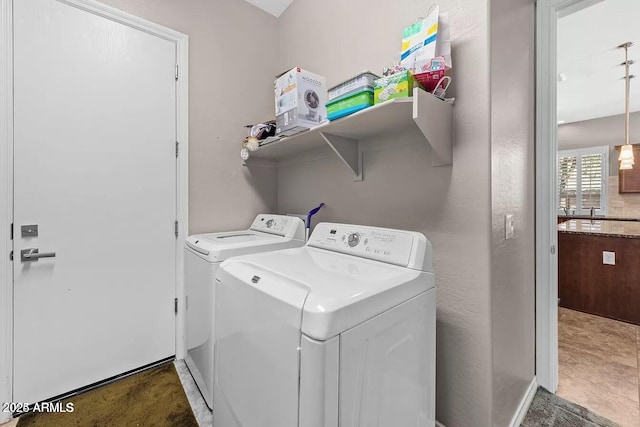 laundry room featuring washer and clothes dryer