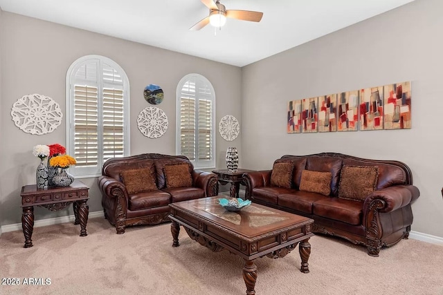 living room with ceiling fan and light carpet