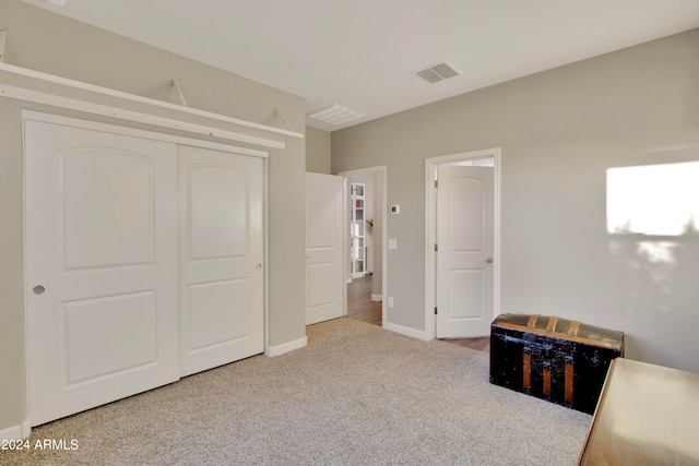 bedroom with carpet and a closet