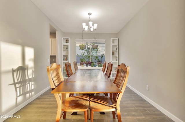 dining space featuring hardwood / wood-style flooring and a notable chandelier