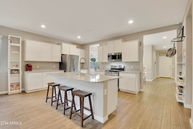 kitchen featuring white cabinets and appliances with stainless steel finishes