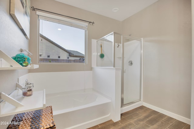 bathroom with separate shower and tub