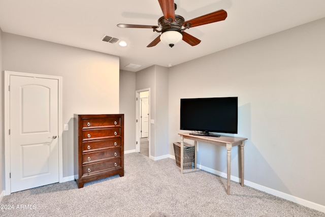 bedroom featuring light colored carpet and ceiling fan