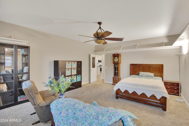 bedroom with ceiling fan and light carpet